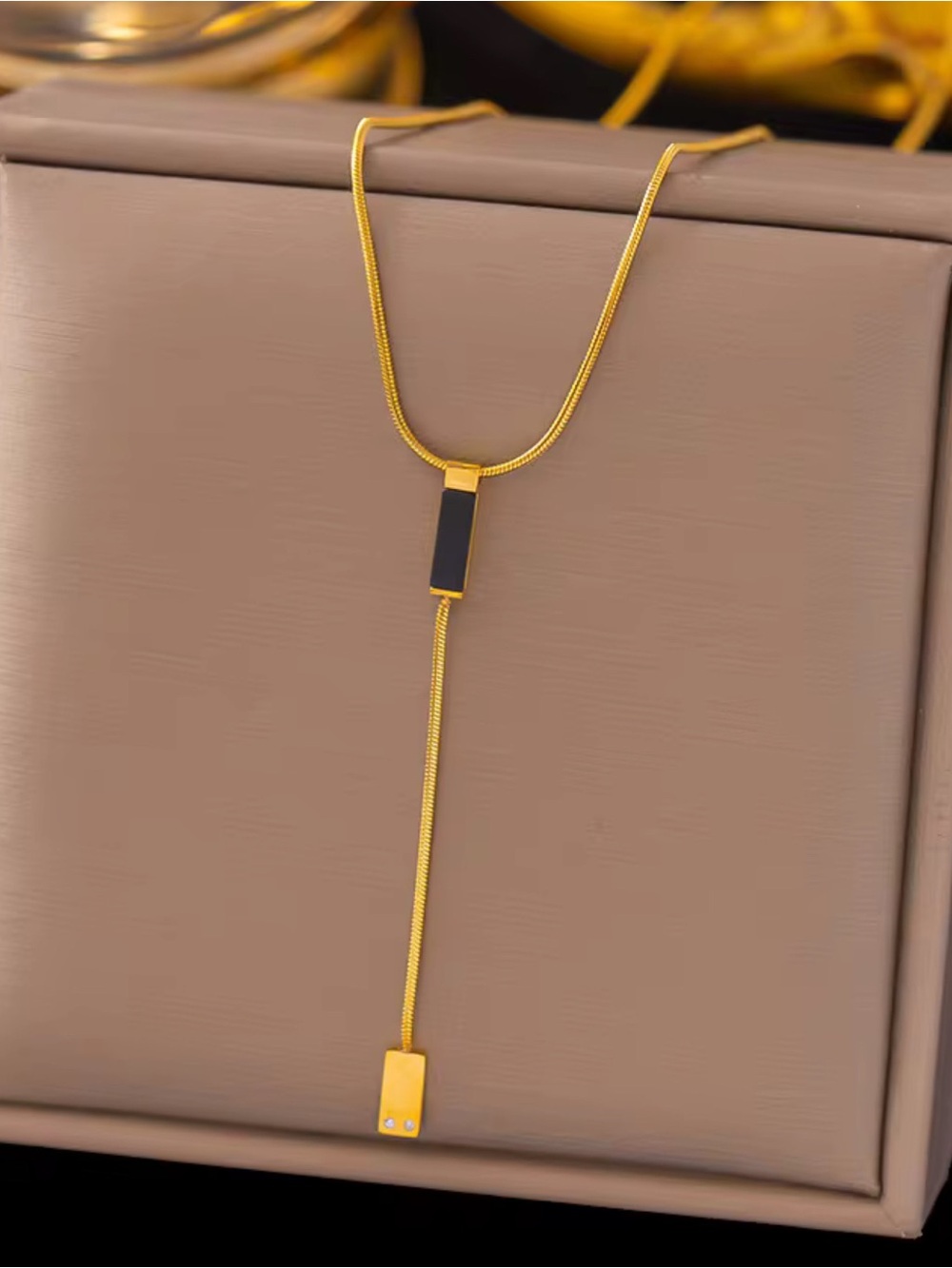 Elegant Gold-Tone Lariat Necklace with Black Accents